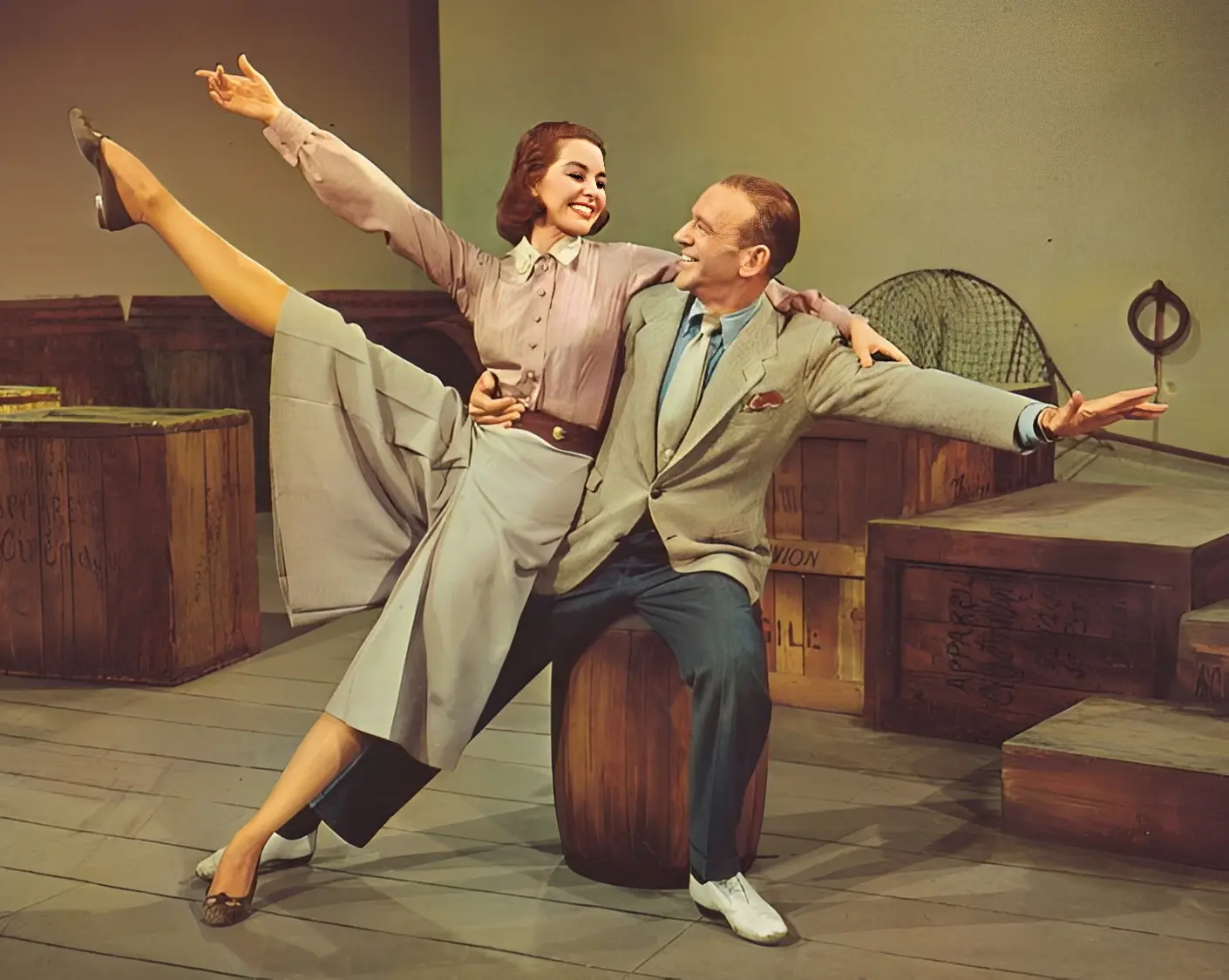 Dancing couple posing on stage with crates.