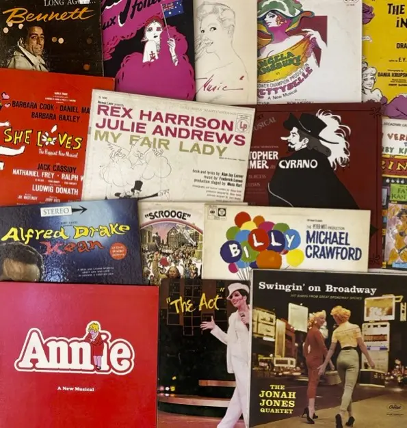 A colorful collection of vintage vinyl record covers from various artists and musicals.