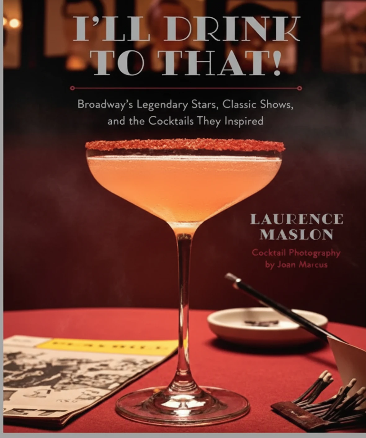 Cocktail on table with book and brochures.